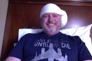 After spending 23 hours in an ICU room, I was discharged from the hospital and sent "home" to our hotel. Here I am modeling my awesome head bandage and a roller derby t-shirt.
